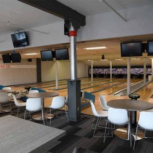 Bowling alley with tables behind the lanes