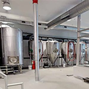 enix-brewing-brewery Large beer manufacturing containers in a factory