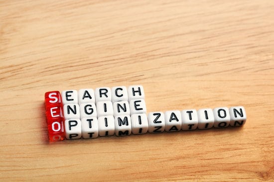 SEO Search Engine Optimization written on dices on wooden background for keyword density